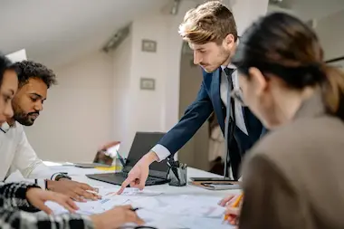 Financial advisors analyzing exchange rates to offer secure and convenient currency services
